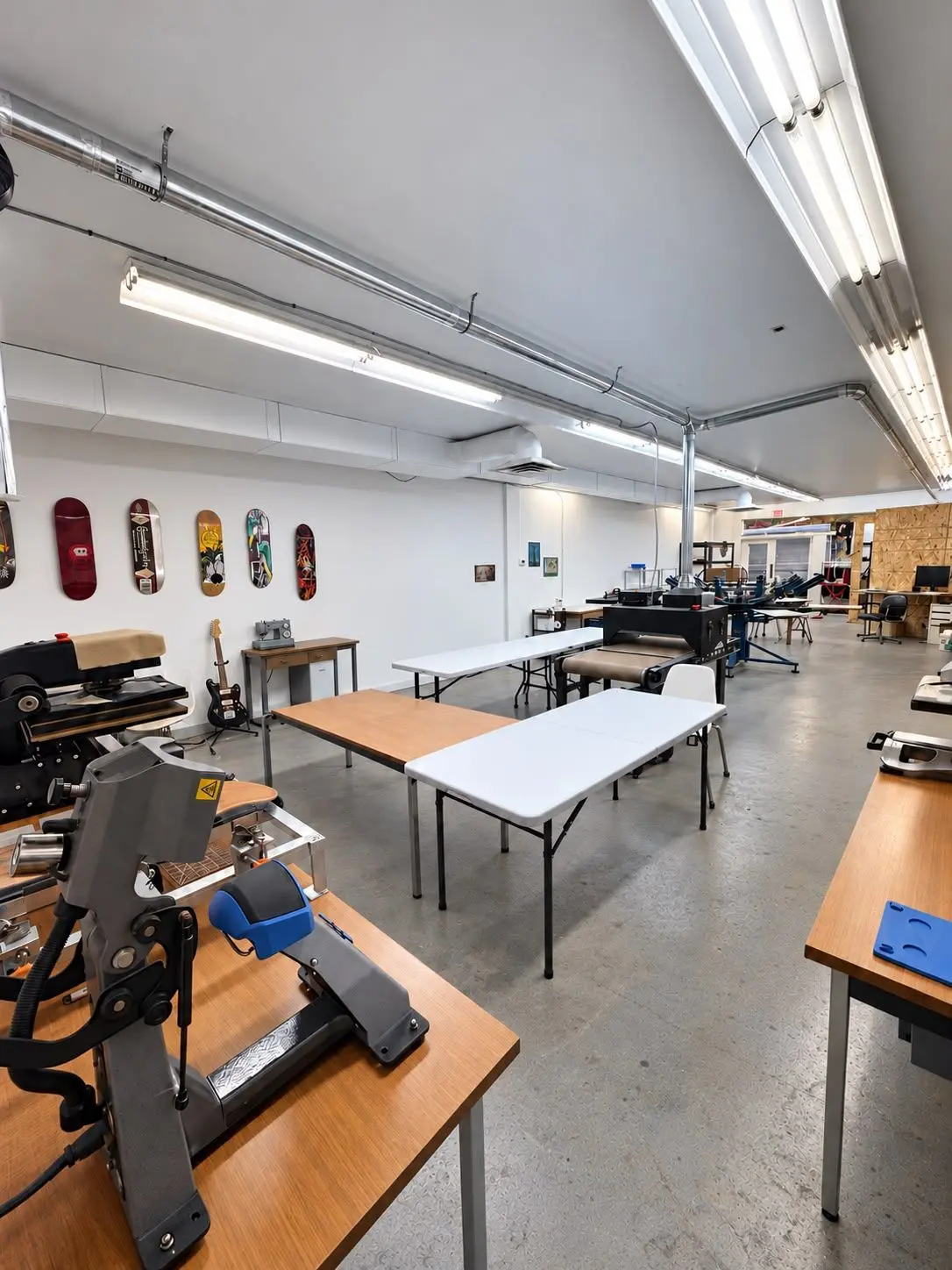 The Takedown Studio workshop in Bromont, with the heat presses and the screen printing dryer